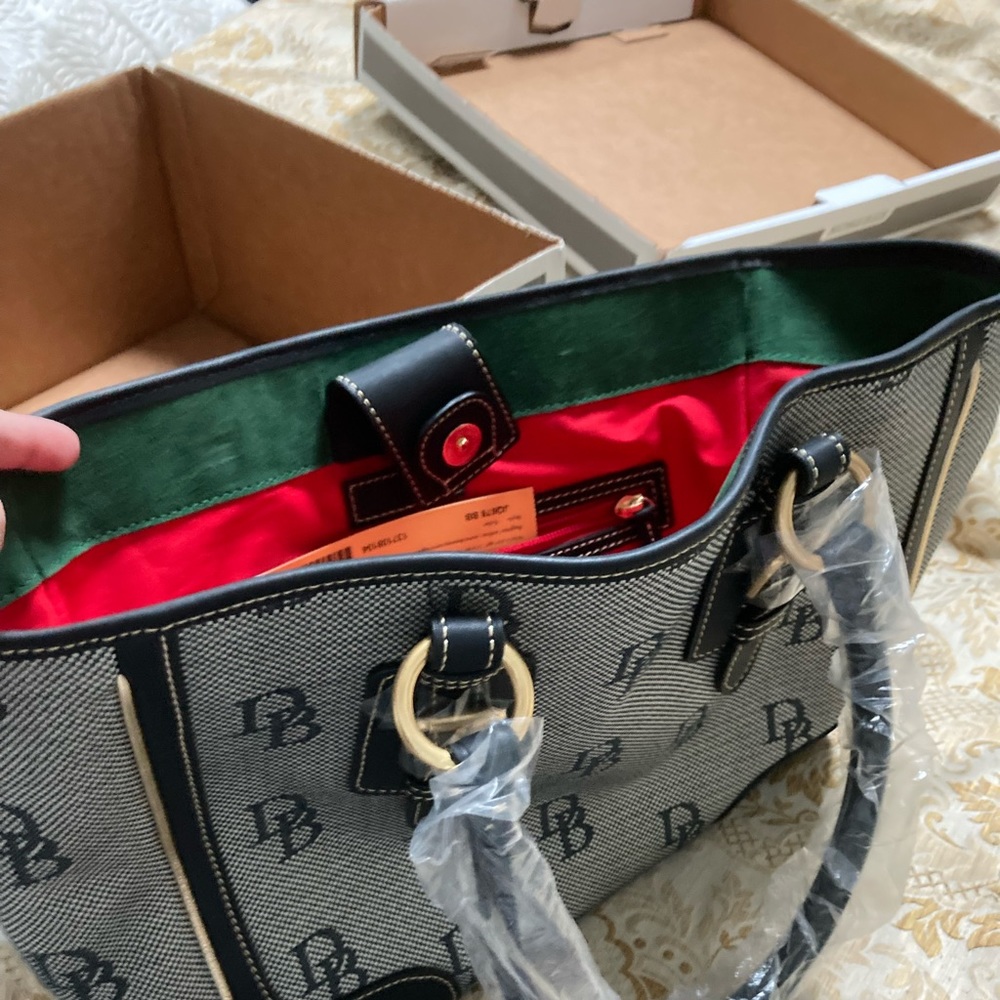 New Dooney & Bourke shoulder bag. Black & grey with gold piping, zip pockets.